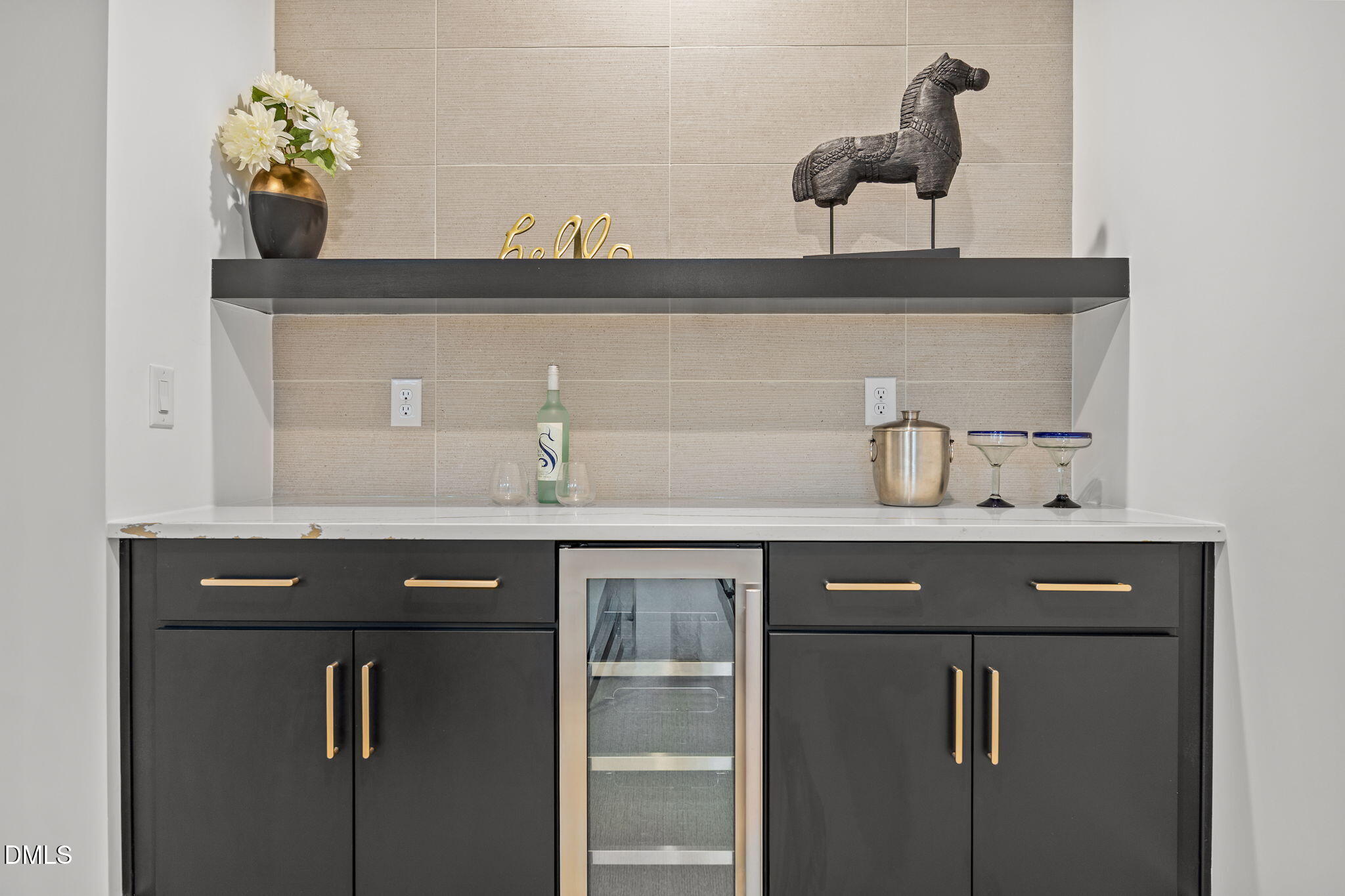 861 Wimbleton Drive Raleigh, NC 27609 - Photo 43 of 62 a closeup of a sink with a potted plant on a counter