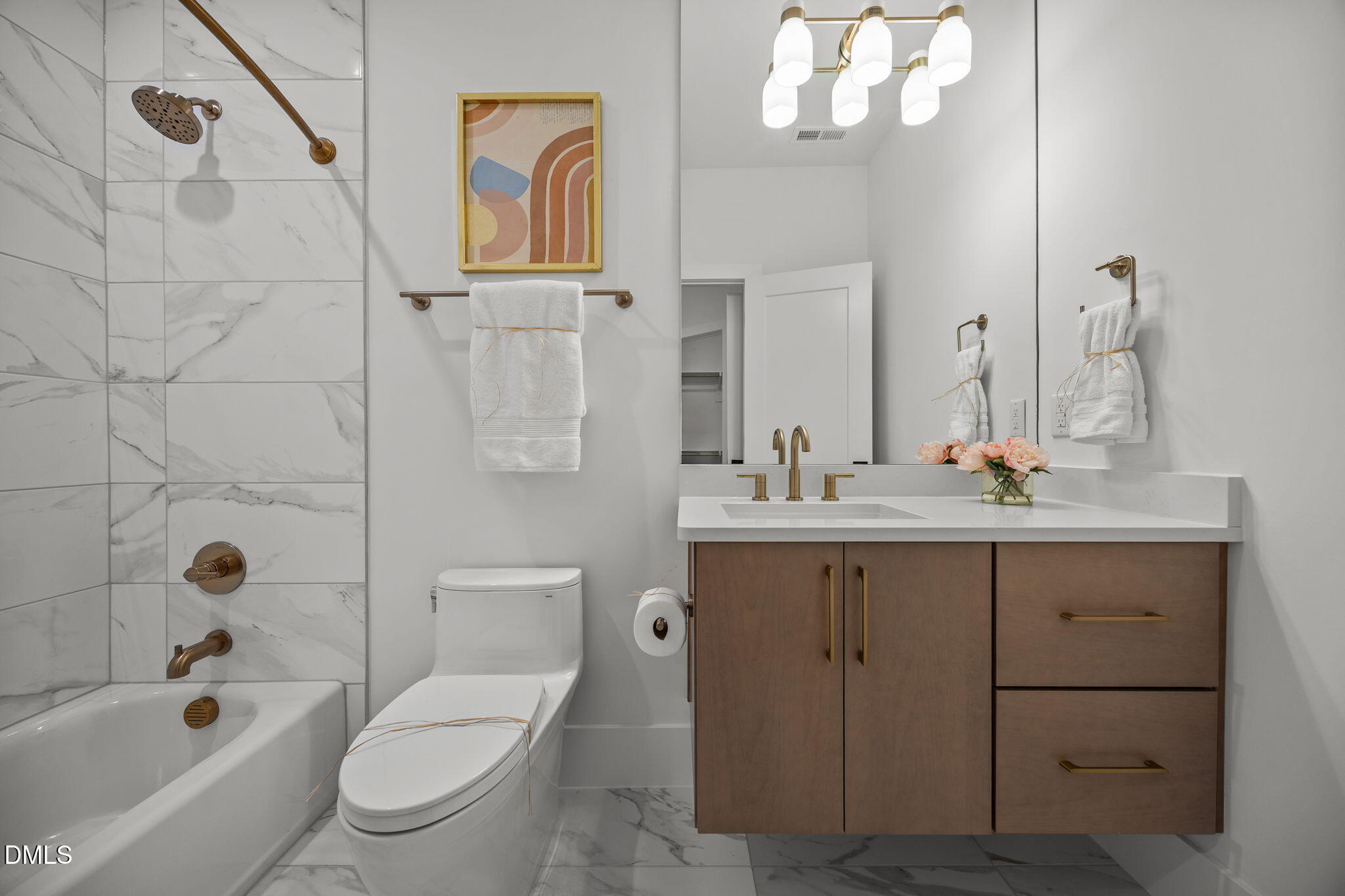 861 Wimbleton Drive Raleigh, NC 27609 - Photo 45 of 62 a bathroom with a granite countertop toilet a sink a mirror a bathtub and shower