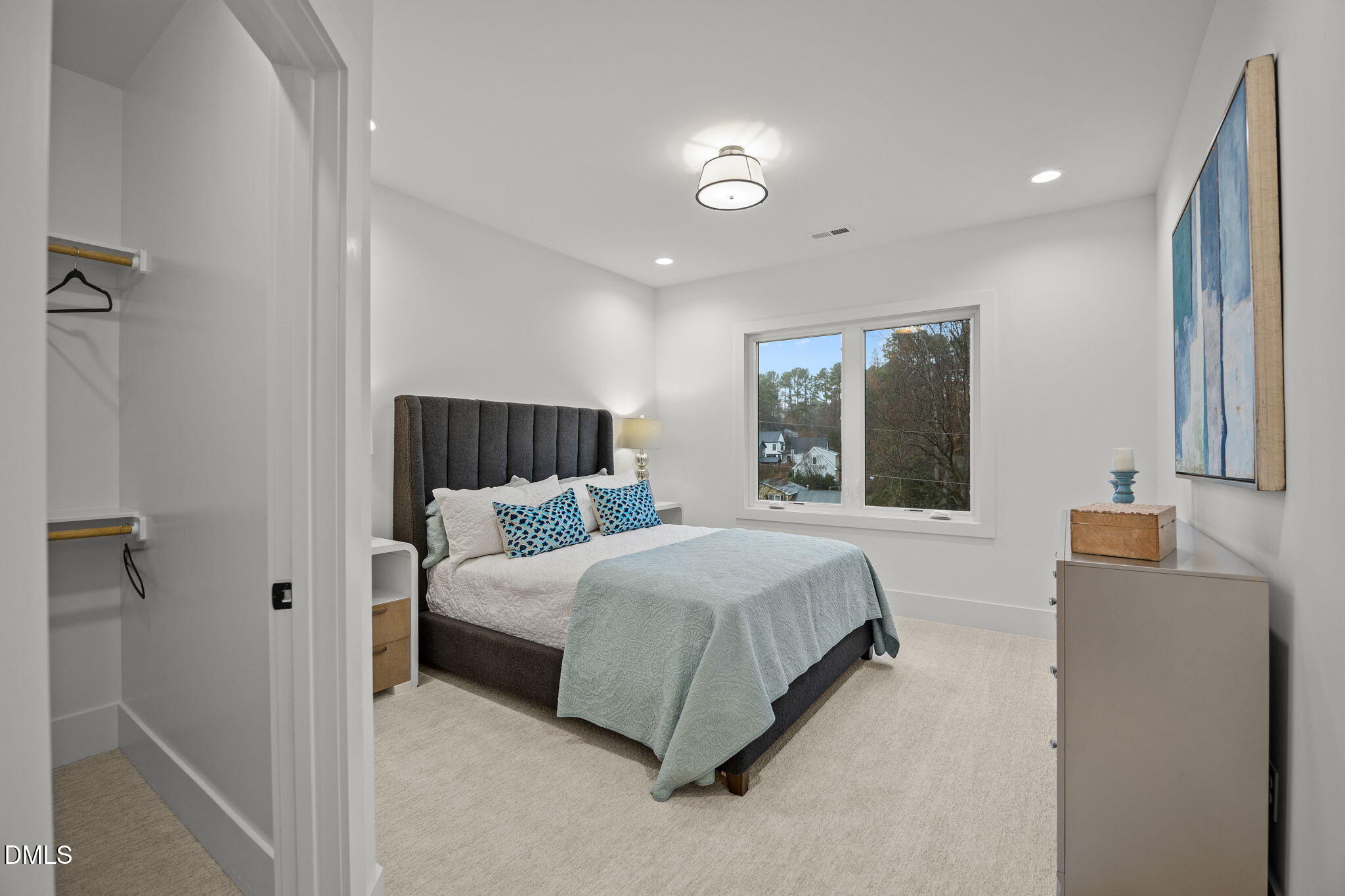 861 Wimbleton Drive Raleigh, NC 27609 - Photo 47 of 64 a spacious bedroom with a bed and a couch