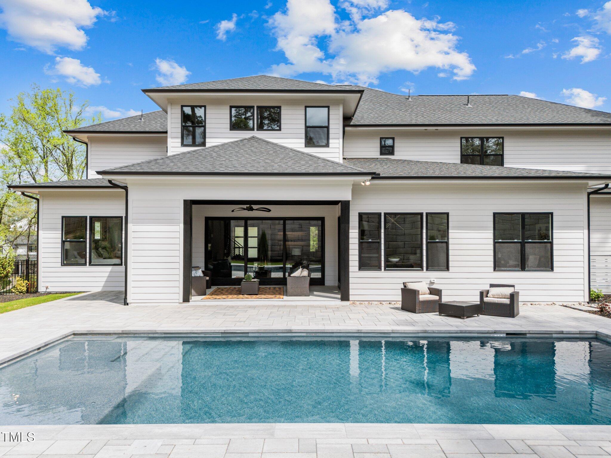 861 Wimbleton Drive Raleigh, NC 27609 - Photo 56 of 64 a front view of a house with outdoor seating