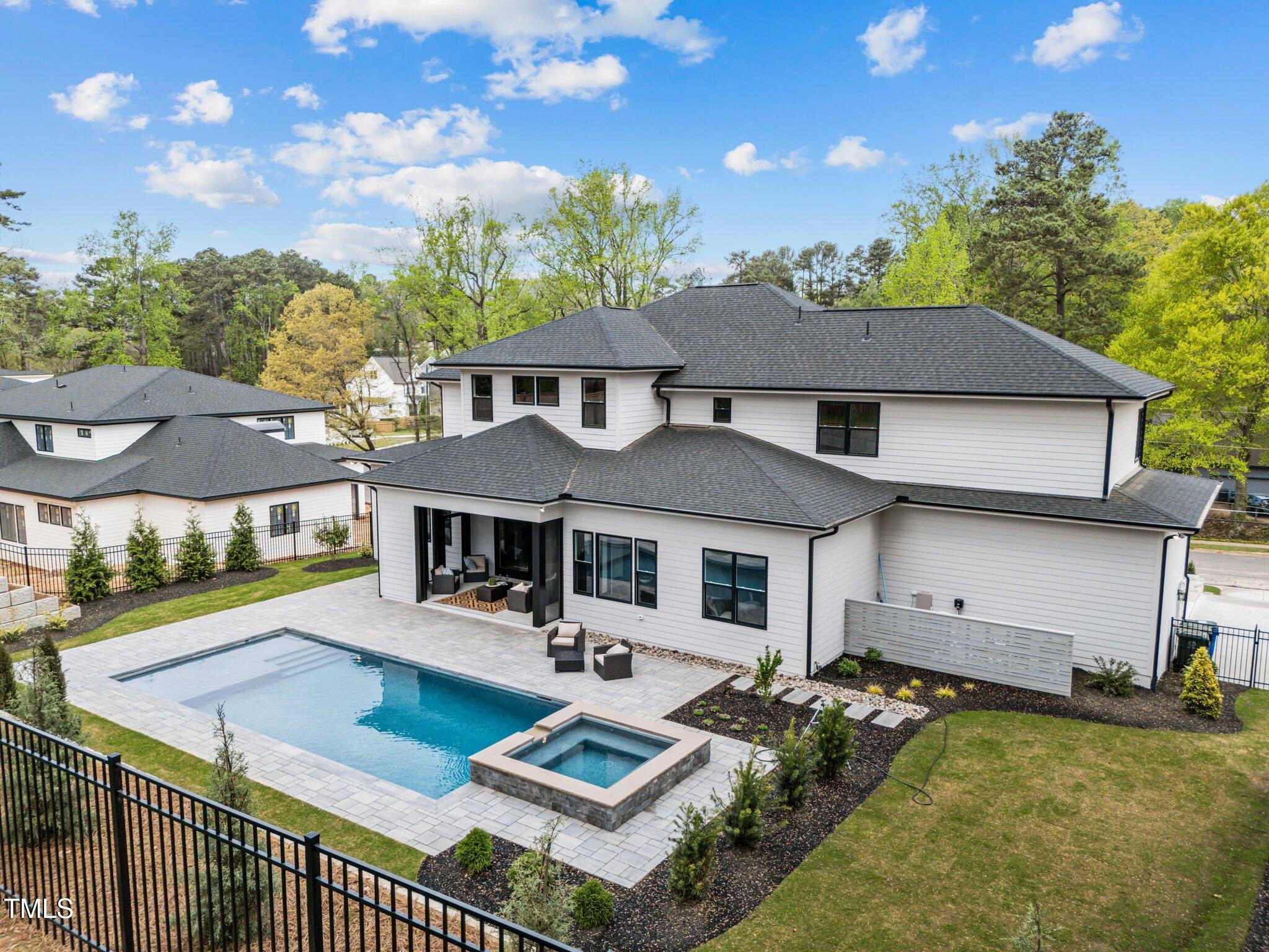 861 Wimbleton Drive Raleigh, NC 27609 - Photo 59 of 64 a view of a house with pool and a yard