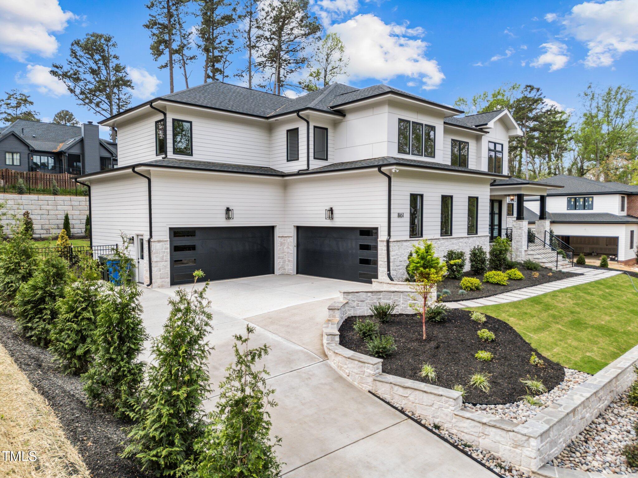 861 Wimbleton Drive Raleigh, NC 27609 - Photo 61 of 64 a front view of a house with garden