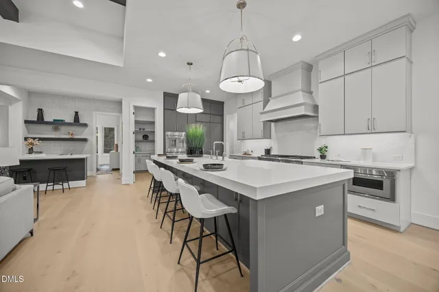 a kitchen with a stove and a refrigerator