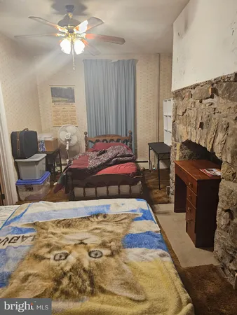 a bedroom with bed and window