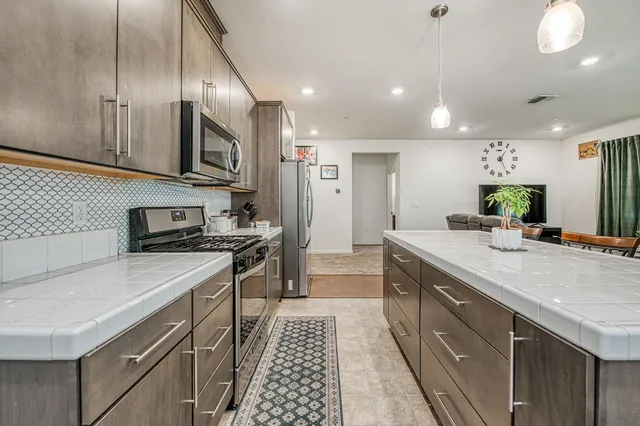 a large bathroom with a large mirror vanity and a shower
