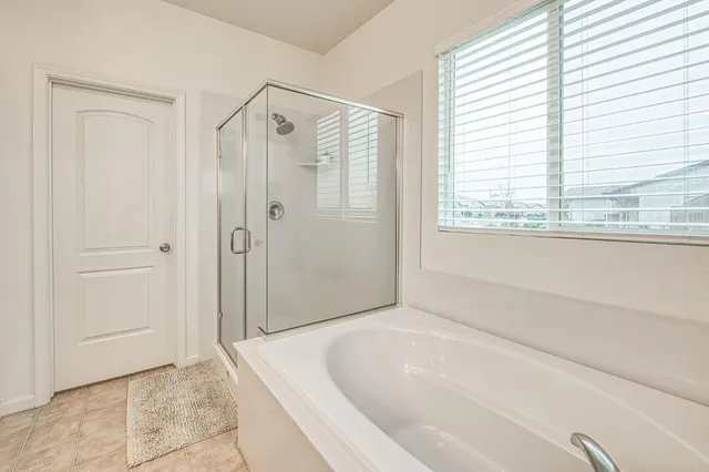 a view of a house with backyard and porch