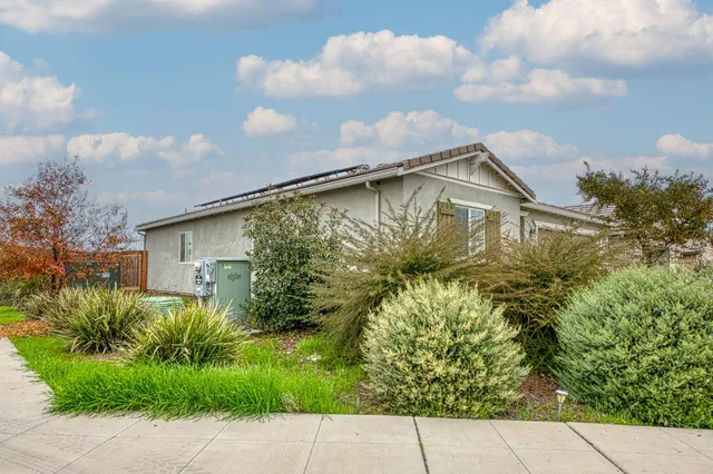 a backyard of a house with lots of green space