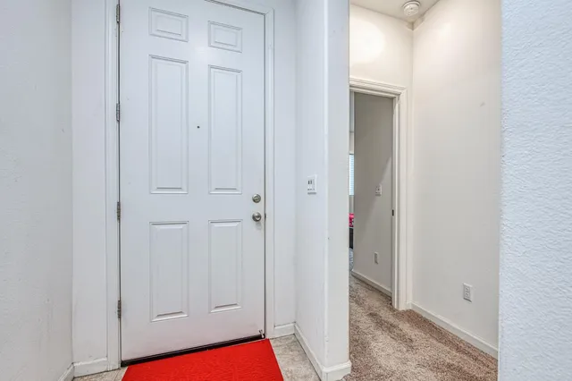 a bedroom with a bed and a tv