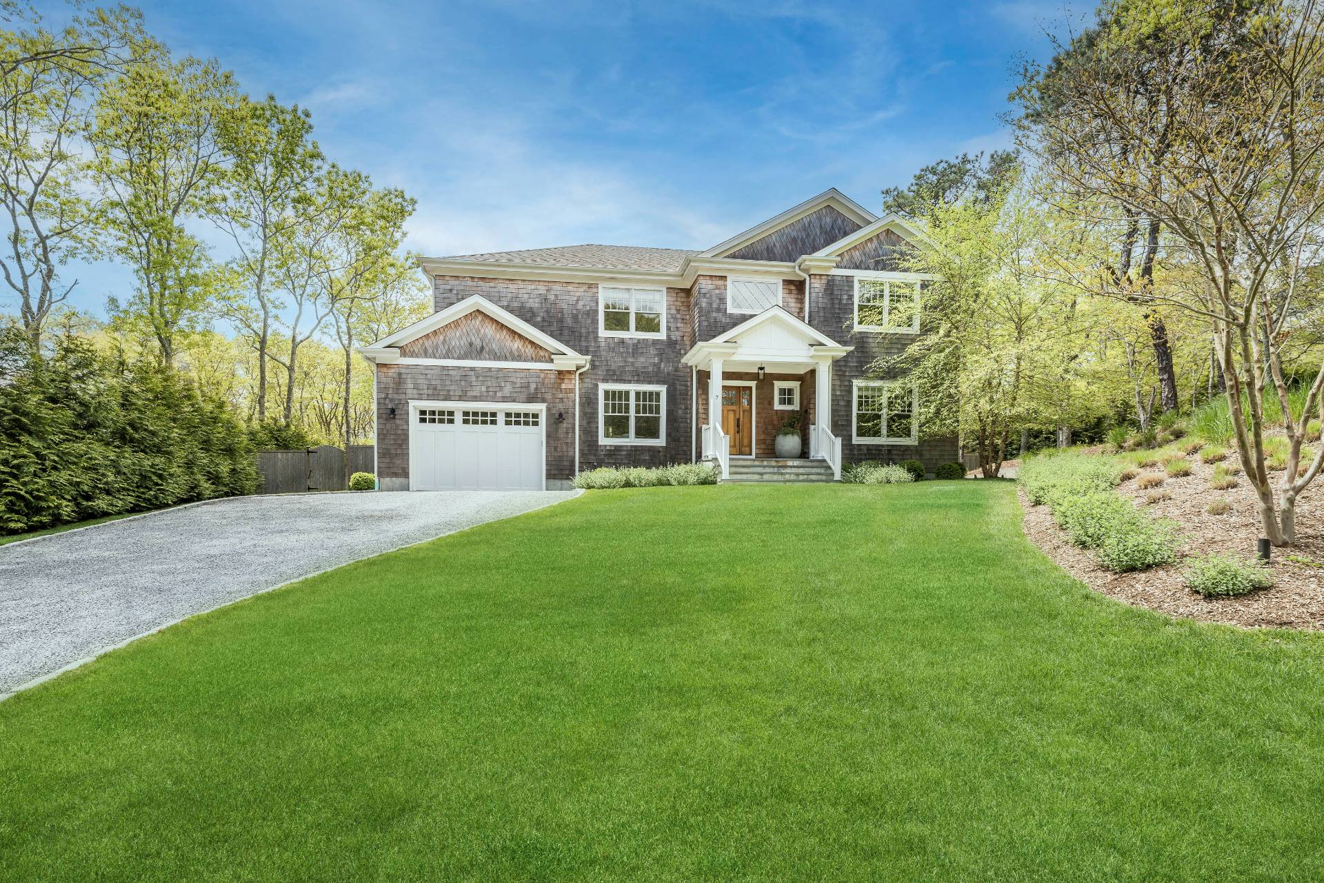 7 Park Street East Hampton, NY 11937 - Photo 2 of 23 a front view of a house with a yard