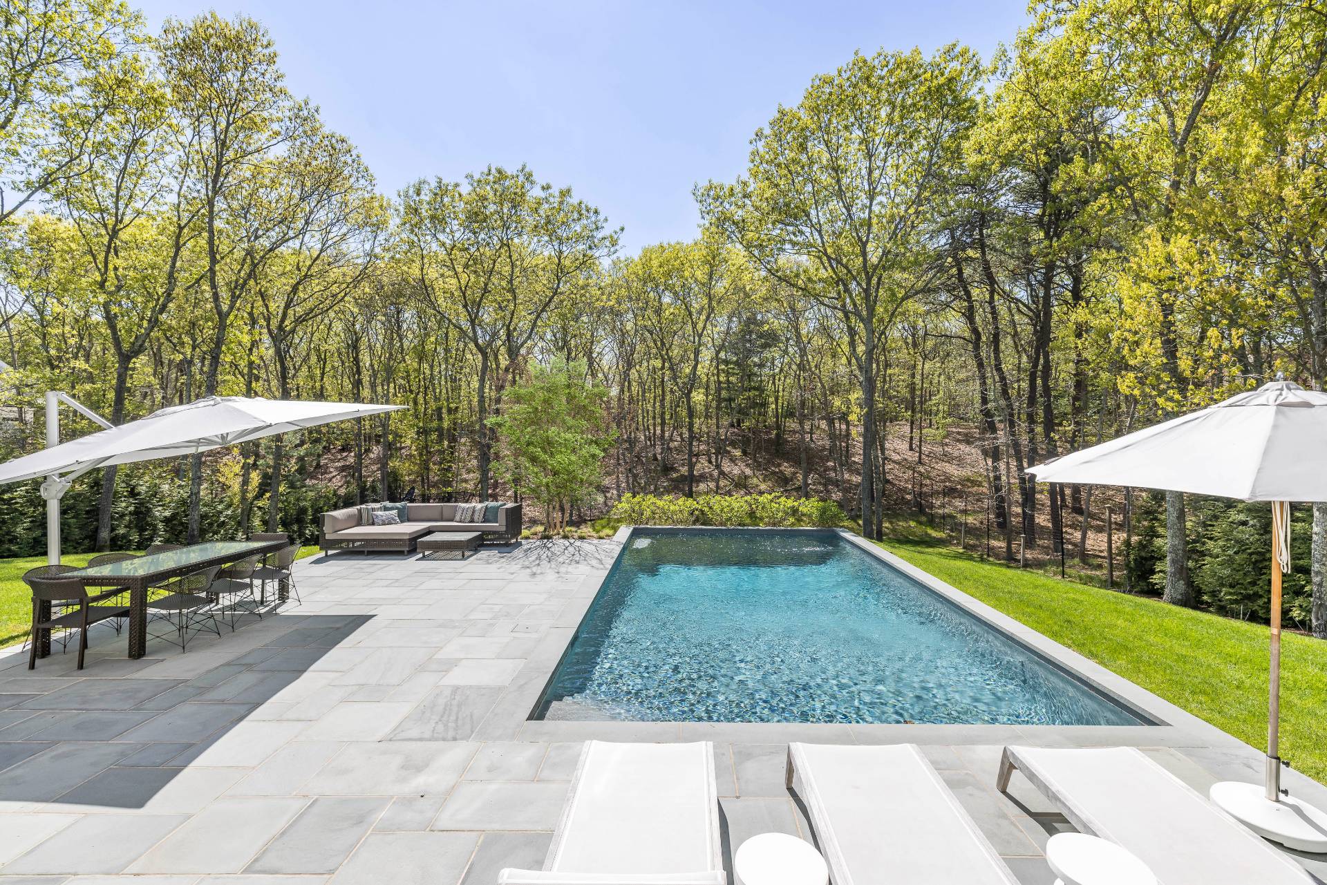 7 Park Street East Hampton, NY 11937 - Photo 3 of 23 a view of a backyard with swimming pool