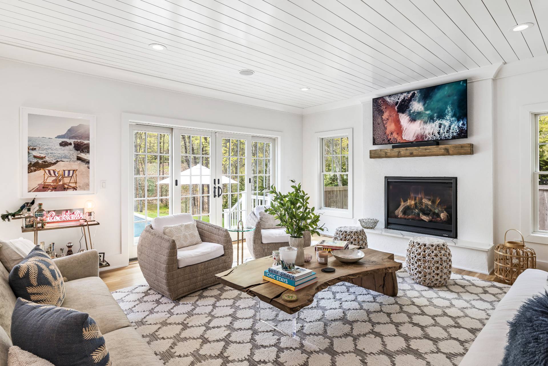 7 Park Street East Hampton, NY 11937 - Photo 6 of 23 a living room with furniture a flat screen tv and a fireplace