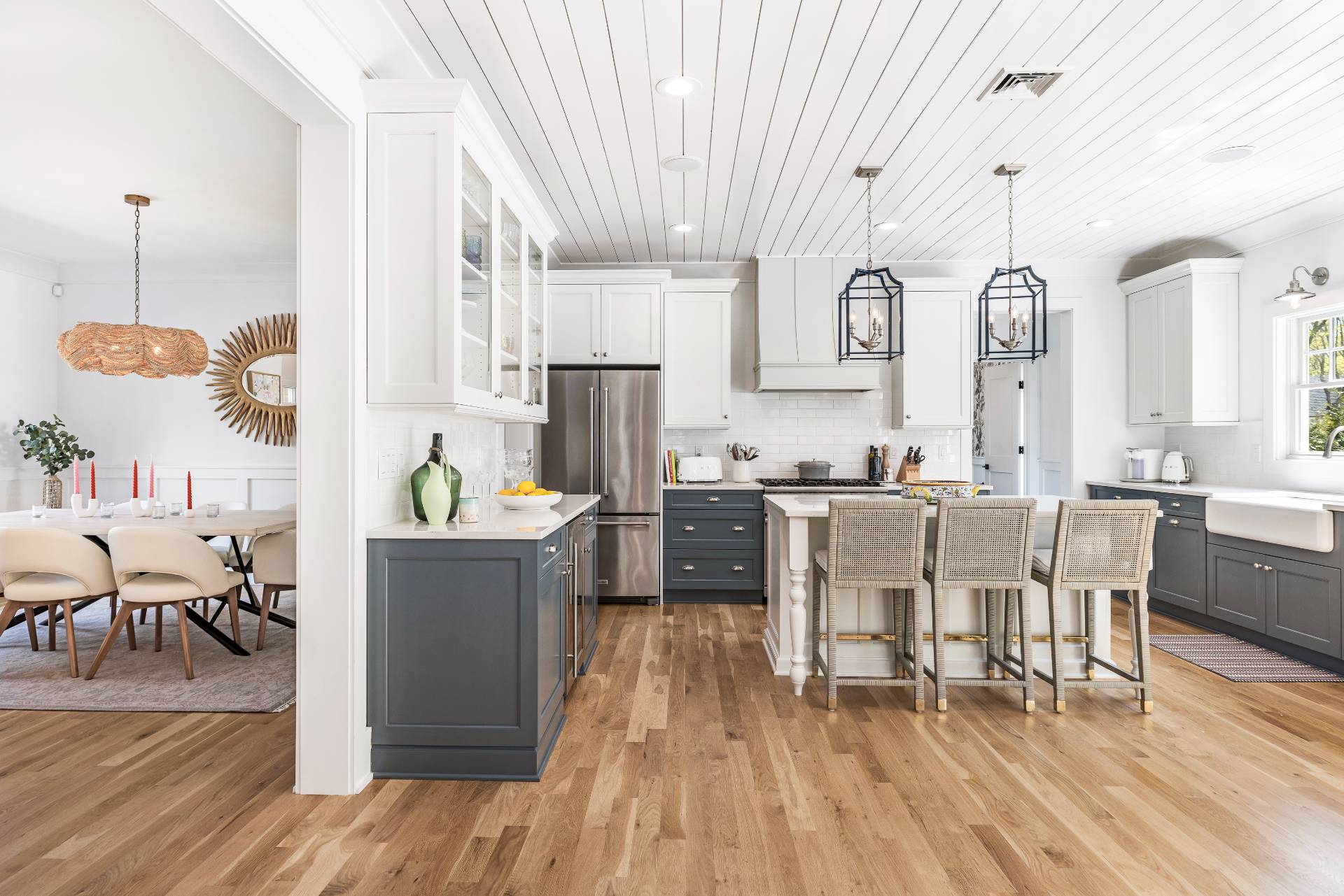 7 Park Street East Hampton, NY 11937 - Photo 8 of 23 a kitchen with stainless steel appliances kitchen island granite countertop a table chairs and a wooden floor