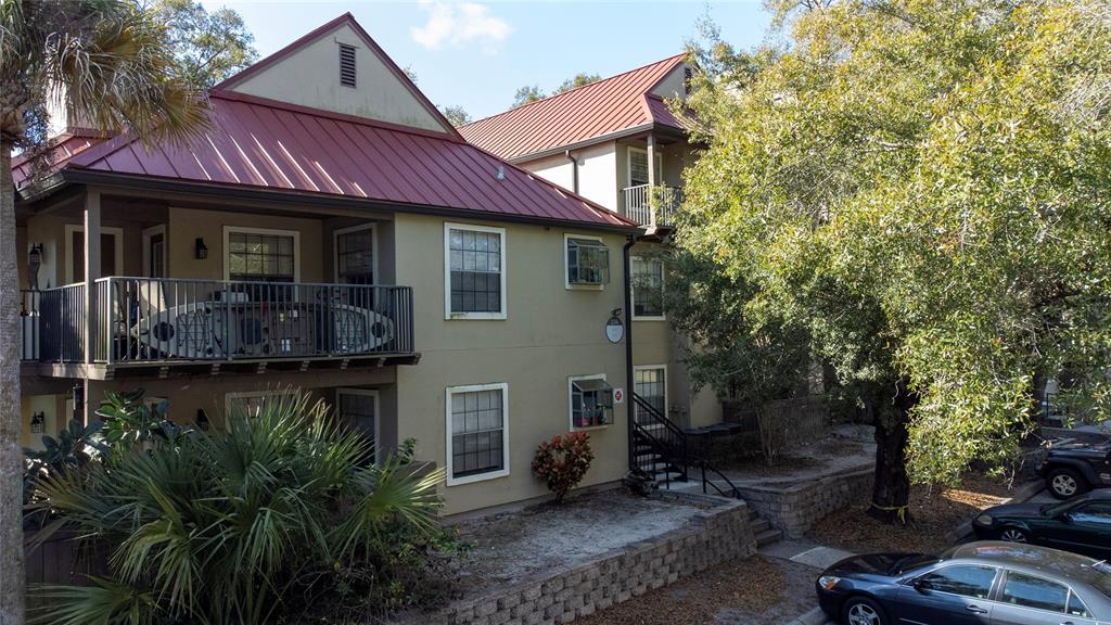 234 Afton Square, Unit 304 Altamonte Springs, FL 32714 - Photo 1 of 1 a front view of a house with garden