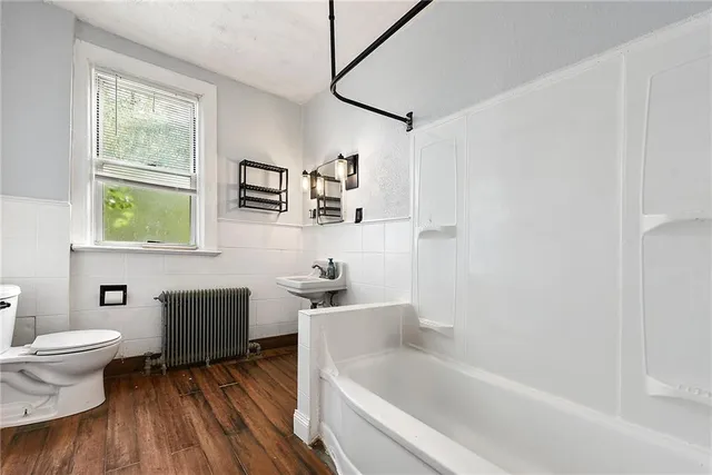 a bathroom with a sink toilet and bathtub