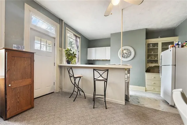 a kitchen with stainless steel appliances a refrigerator and microwave