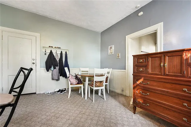 a dining room with furniture and entryway
