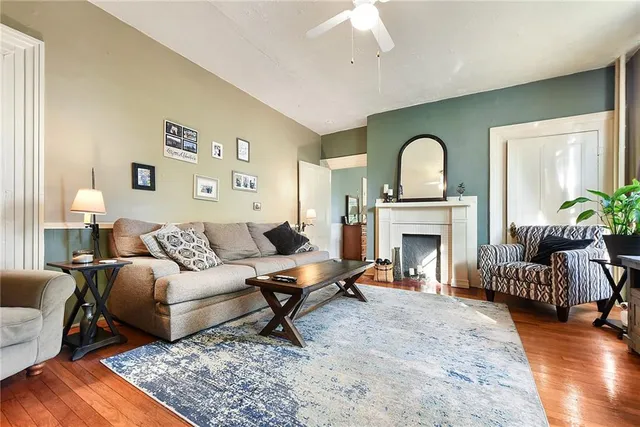 a living room with furniture and a fireplace
