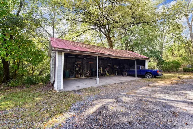 a view of a backyard with large trees