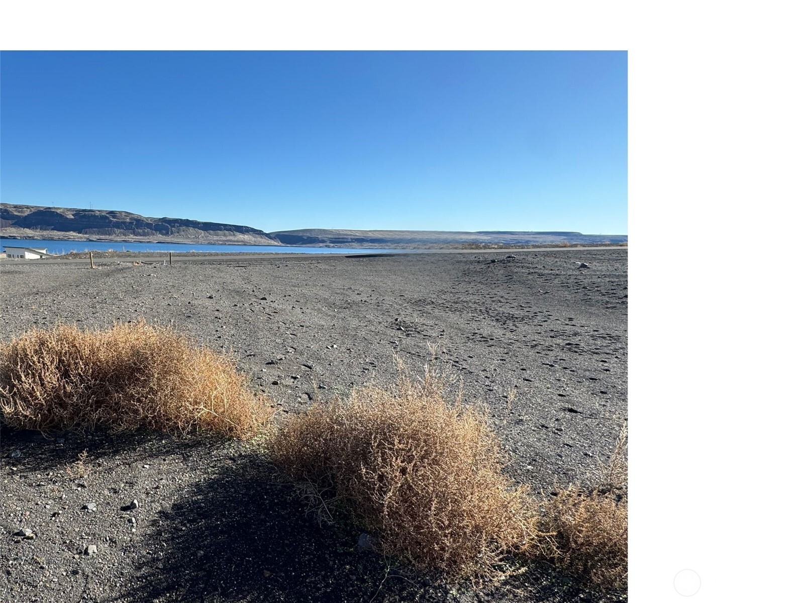 531 Bridgeview Drive Vantage, WA 98950 - Photo 6 of 17 a view of a lake from a yard