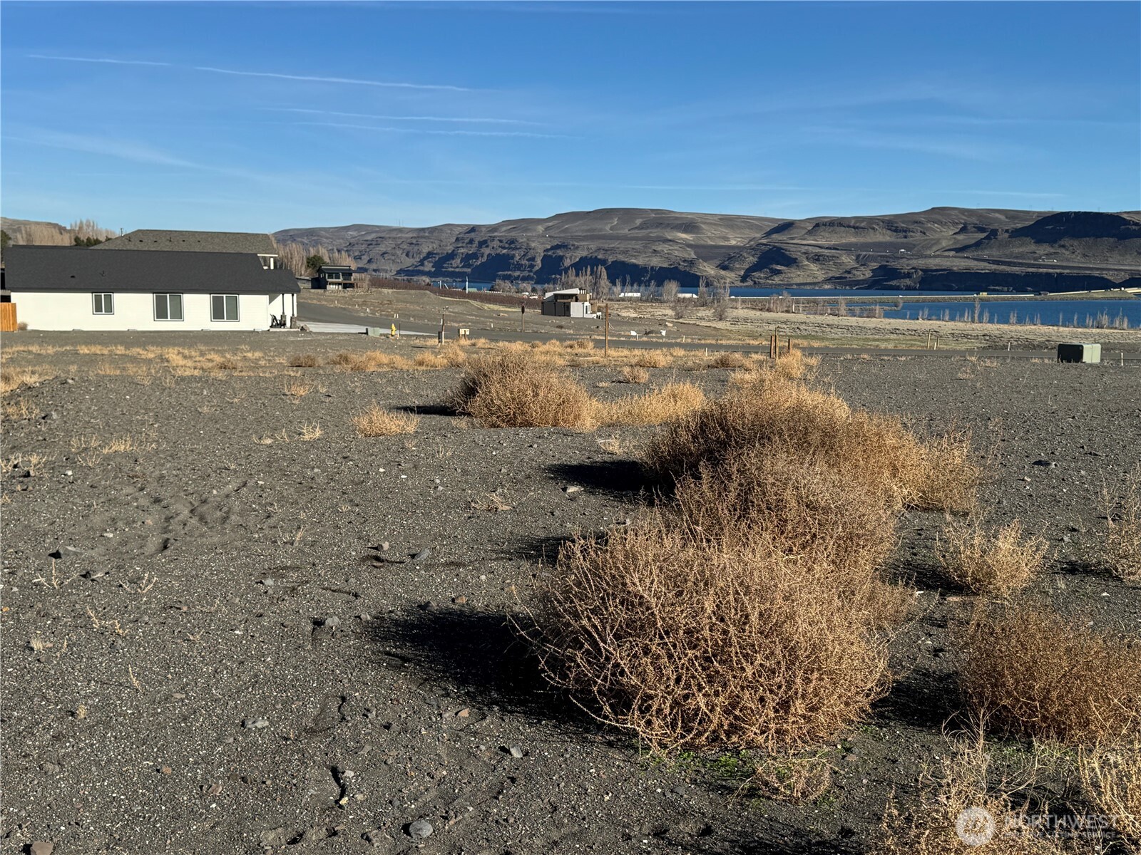 531 Bridgeview Drive Vantage, WA 98950 - Photo 7 of 17 a view of a lake with a building in the background