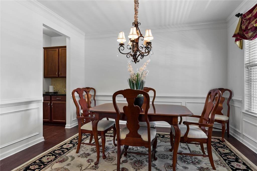 3935 Silver Springs Road Cumming, GA 30041 - Photo 12 of 37 a view of a dining room that has a table and chairs
