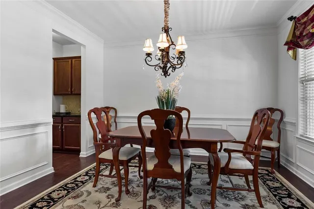 a view of a dining room furniture and wooden floor