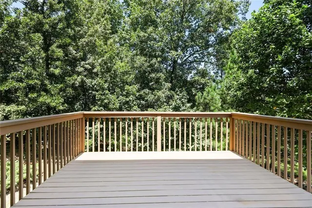 a view of balcony with wooden floor
