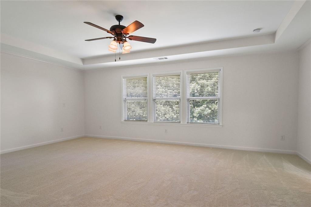 3935 Silver Springs Road Cumming, GA 30041 - Photo 18 of 37 wooden floor in an empty room with a window