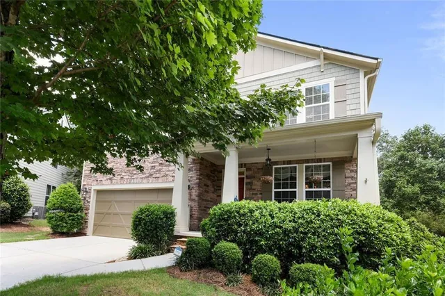 front view of a house with a yard