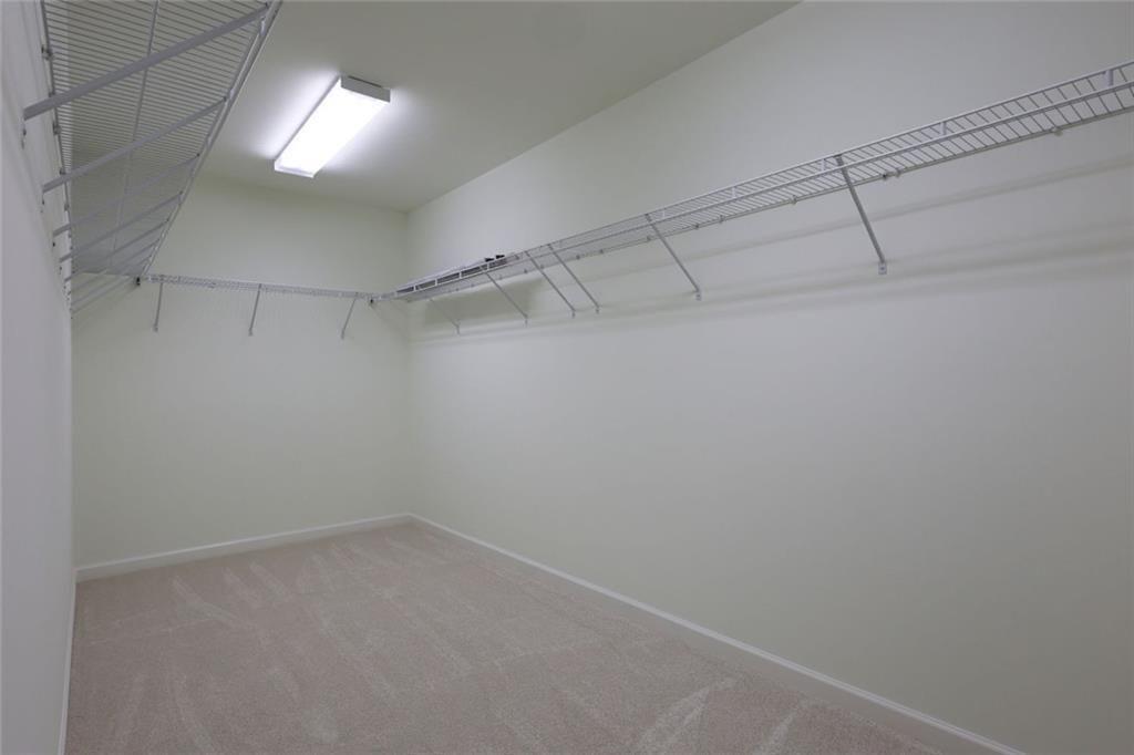 3935 Silver Springs Road Cumming, GA 30041 - Photo 22 of 37 a view of a room with racks on the wall