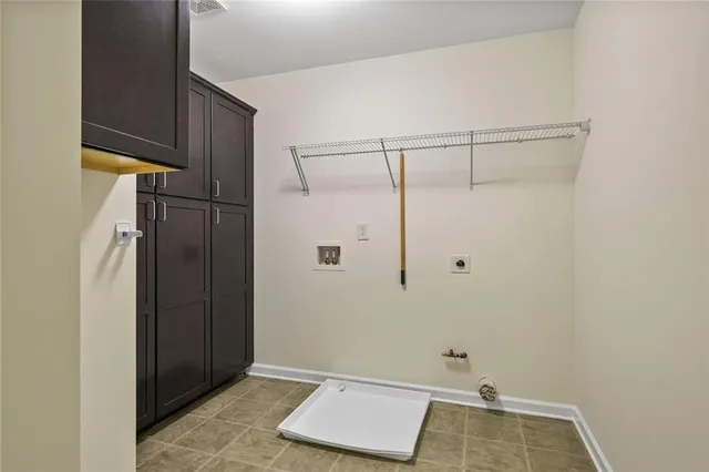 a living room with couches and a flat screen tv