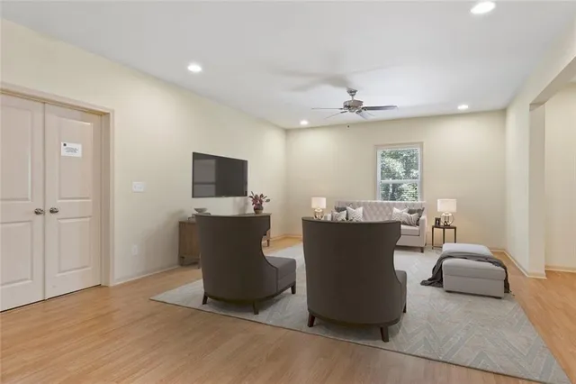a view of a room with furniture and wooden floor