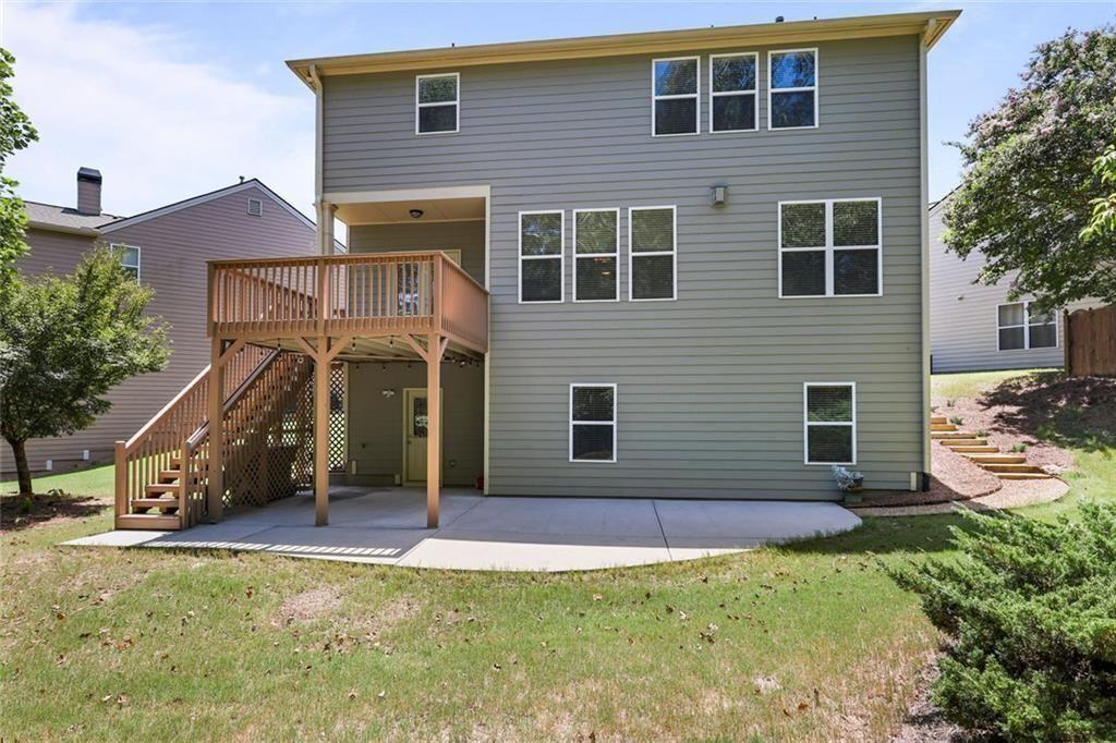 3935 Silver Springs Road Cumming, GA 30041 - Photo 32 of 37 a front view of a house with garden