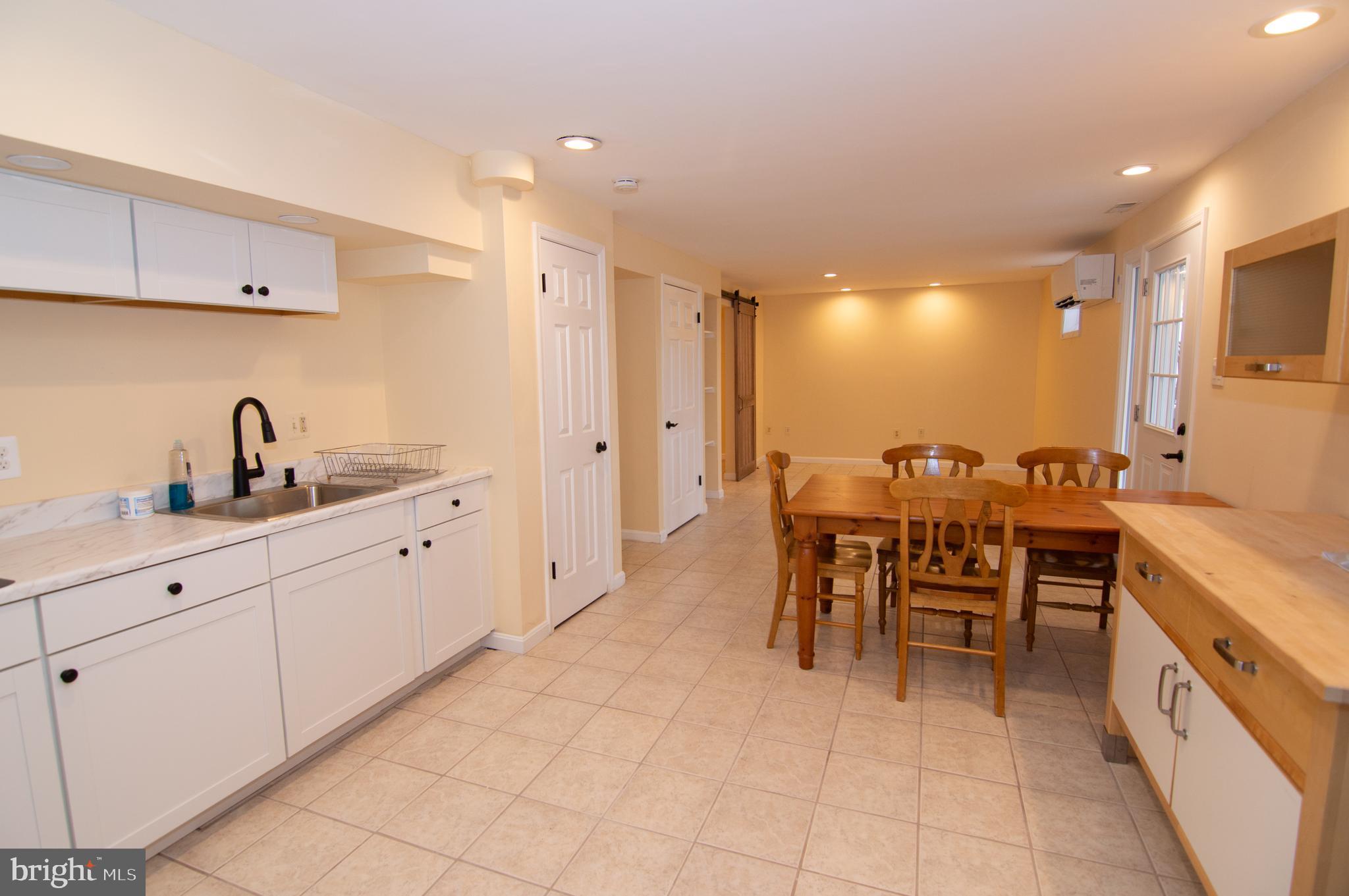 404 Talahi Road Southeast Vienna, VA 22180 - Photo 15 of 31 Kitchen / Living Room / Dining Room