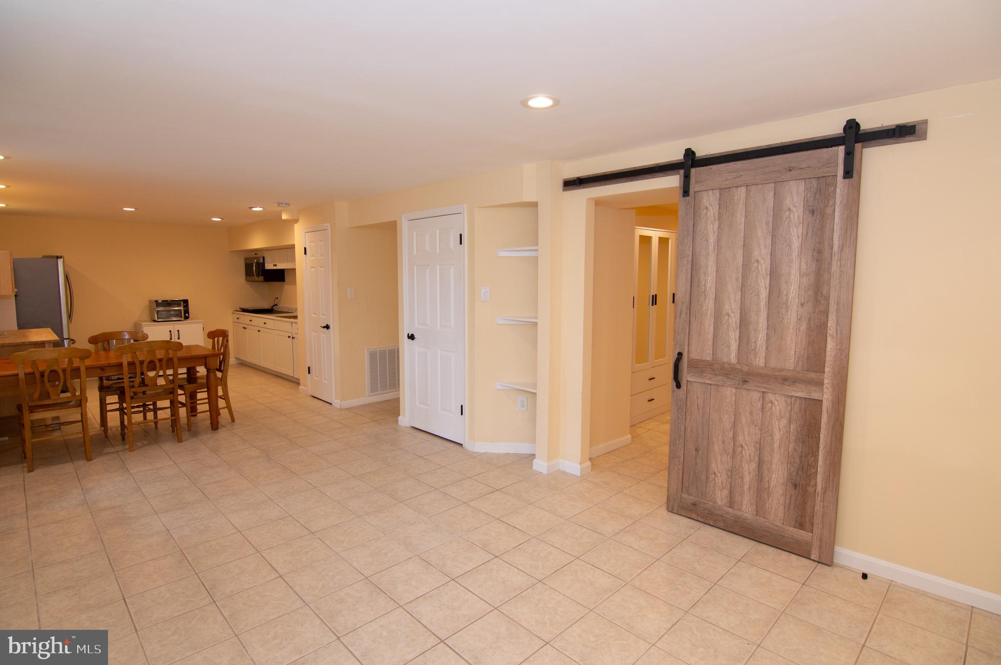 404 Talahi Road Southeast Vienna, VA 22180 - Photo 19 of 31 Living Room / Dining Room / Kitchen