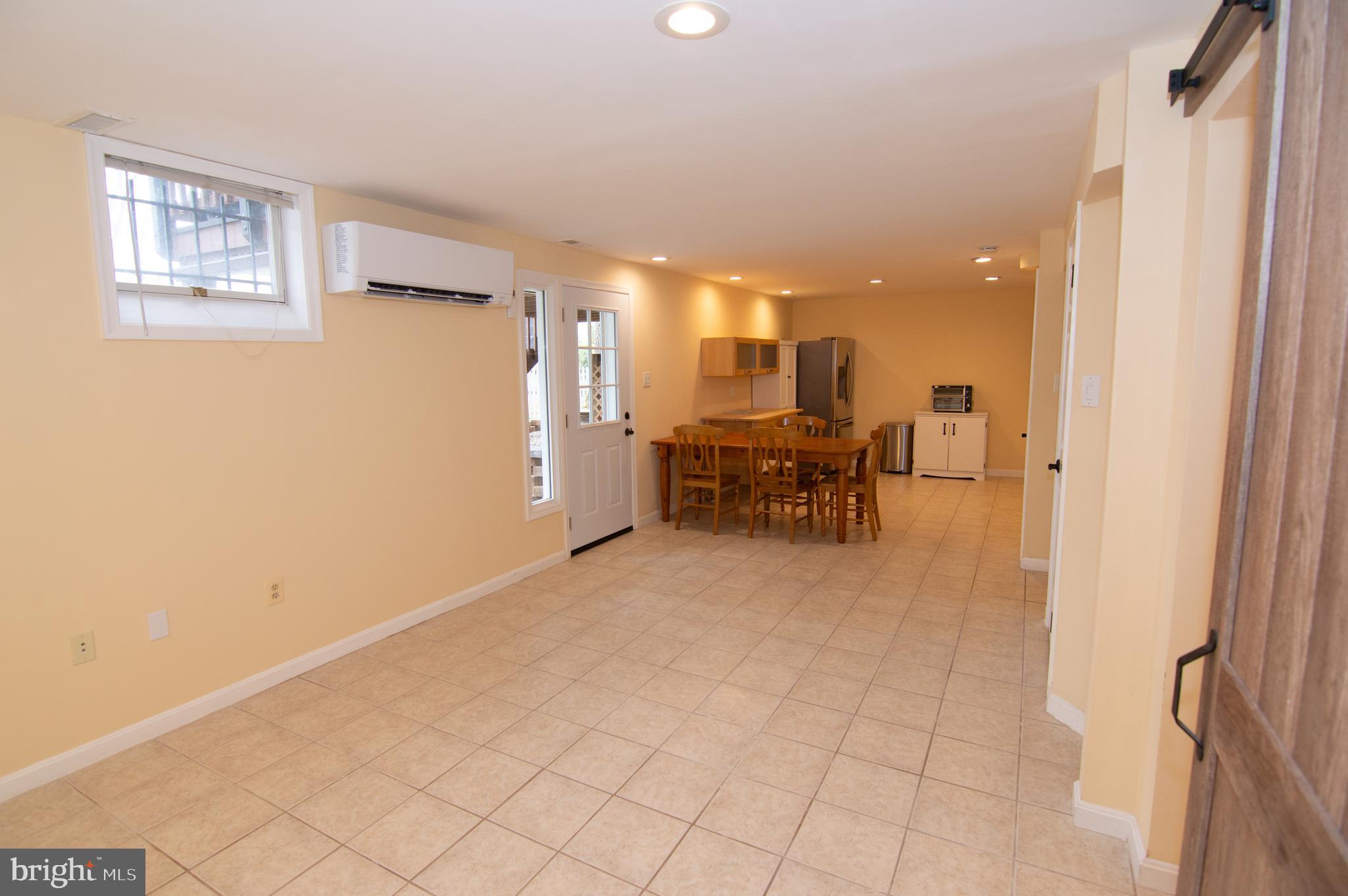 404 Talahi Road Southeast Vienna, VA 22180 - Photo 20 of 31 Living Room / Dining Room / Kitchen