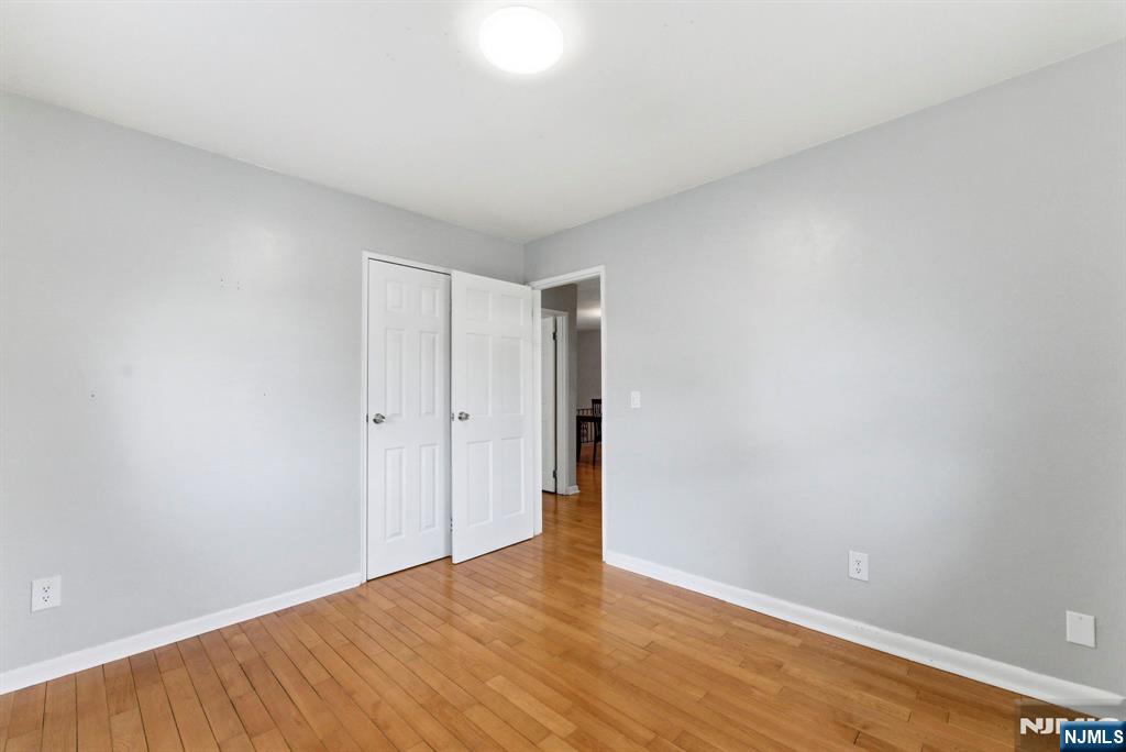 50-56 High Street, Unit 2 Passaic, NJ 07055 - Photo 18 of 30 a view of an empty room with wooden floor