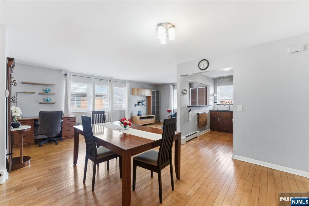 50-56 High Street, Unit 2 Passaic, NJ 07055 - Photo 22 of 30 a view of a dining room with furniture and wooden floor