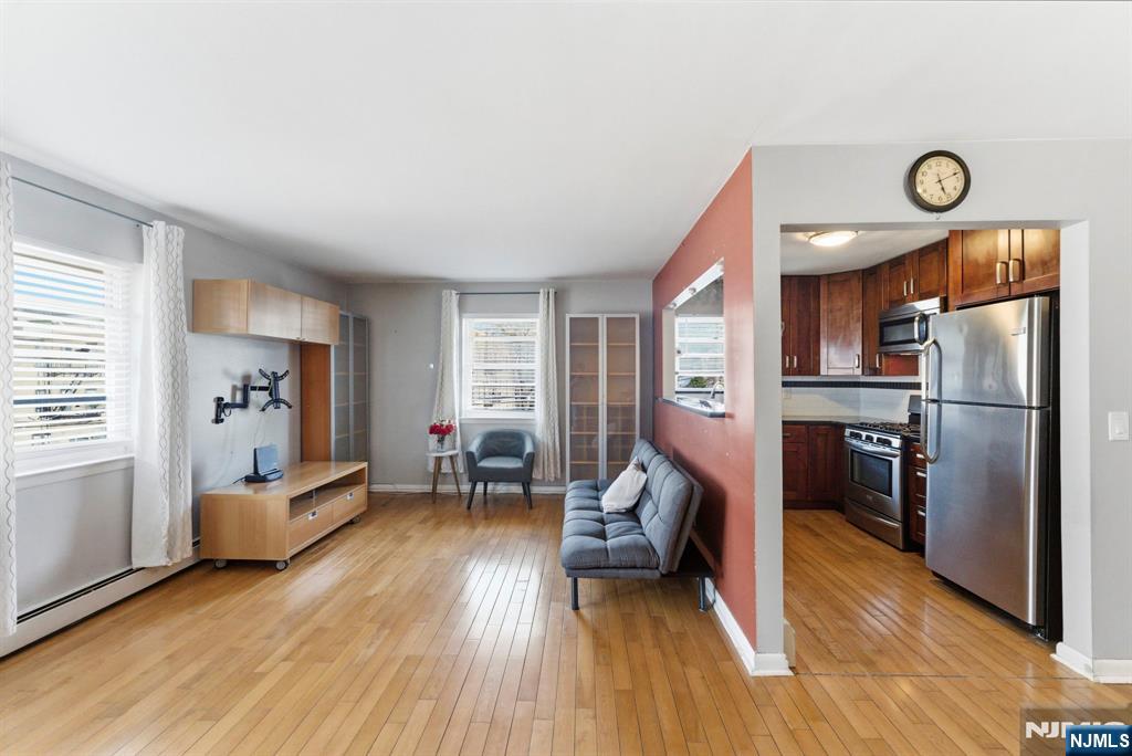 50-56 High Street, Unit 2 Passaic, NJ 07055 - Photo 23 of 30 a living room with furniture and a wooden floor