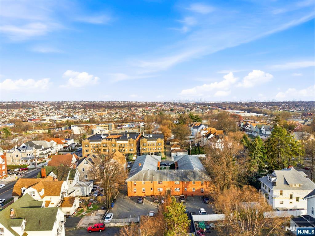 50-56 High Street, Unit 2 Passaic, NJ 07055 - Photo 29 of 30 an aerial view of a city with lots of residential buildings