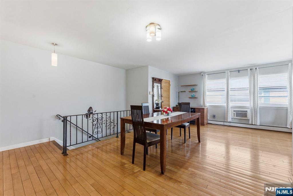 50-56 High Street, Unit 2 Passaic, NJ 07055 - Photo 3 of 30 a view of a dining room with furniture window and wooden floor