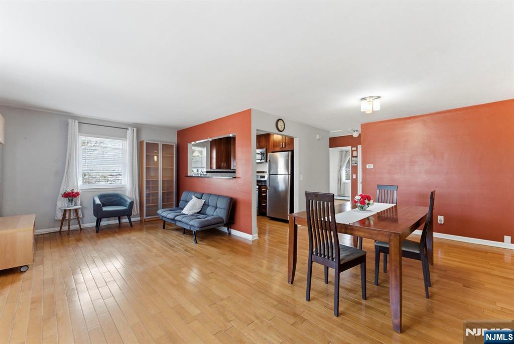 50-56 High Street, Unit 2 Passaic, NJ 07055 - Photo 4 of 30 a living room with furniture and wooden floor