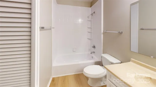 a bathroom with a toilet and a bathtub