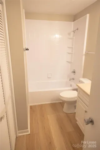 a bathroom with a toilet a sink and bathtub