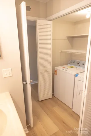 a view of a brick house with a large trees