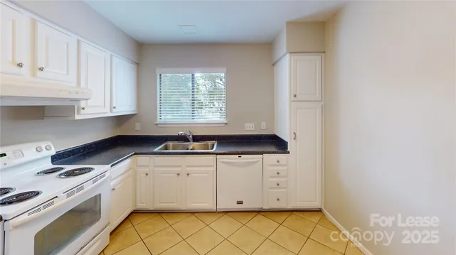 a view of a kitchen with cabinets