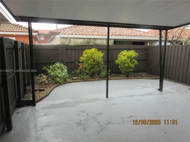 a view of potted plant in front of a building