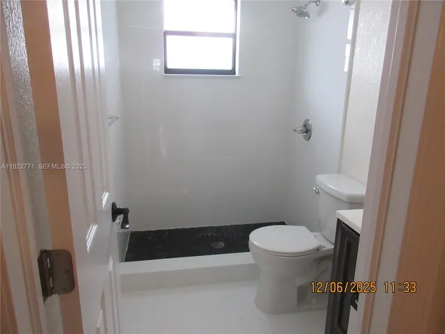 a bathroom with a toilet and a sink