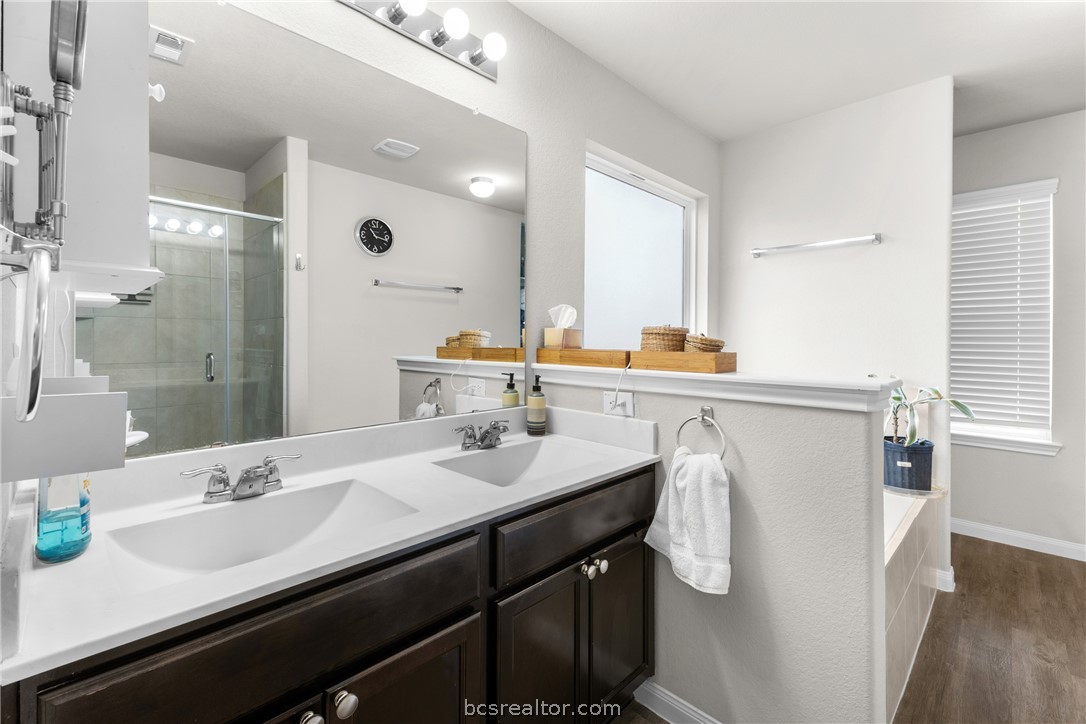 984 Crossing Drive Bryan, TX 77803 - Photo 15 of 29 a bathroom with a sink double vanity and a mirror