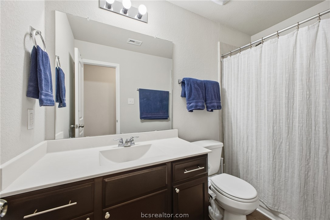 984 Crossing Drive Bryan, TX 77803 - Photo 20 of 29 a bathroom with a sink toilet and shower